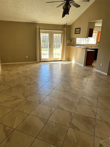 a view of a kitchen with a sink and a kitchen counter top