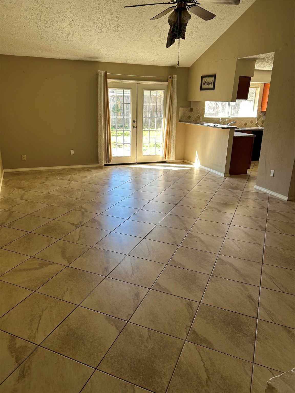 23119 Tree Bright Lane Spring, TX 77373 - Photo 6 of 17 a view of a kitchen with a sink and a kitchen counter top