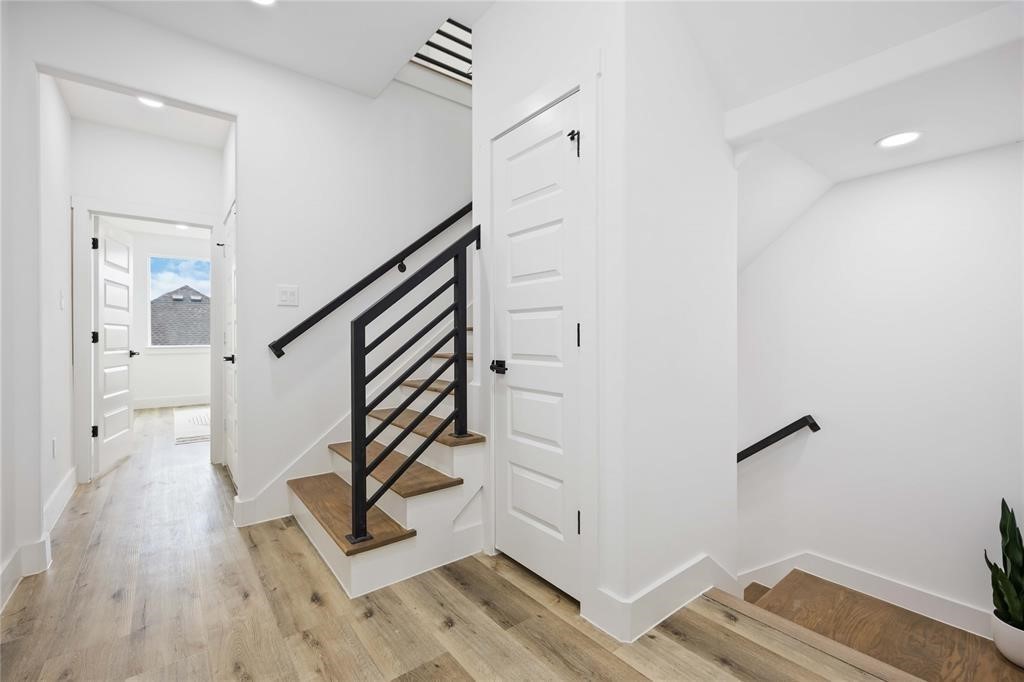 1805 Emir Street, Unit L Houston, TX 77009 - Photo 13 of 35 The second floor includes the primary suite with two large closets, an oversized secondary bedroom with a full ensuite bath, a utility closet, and a storage closet.