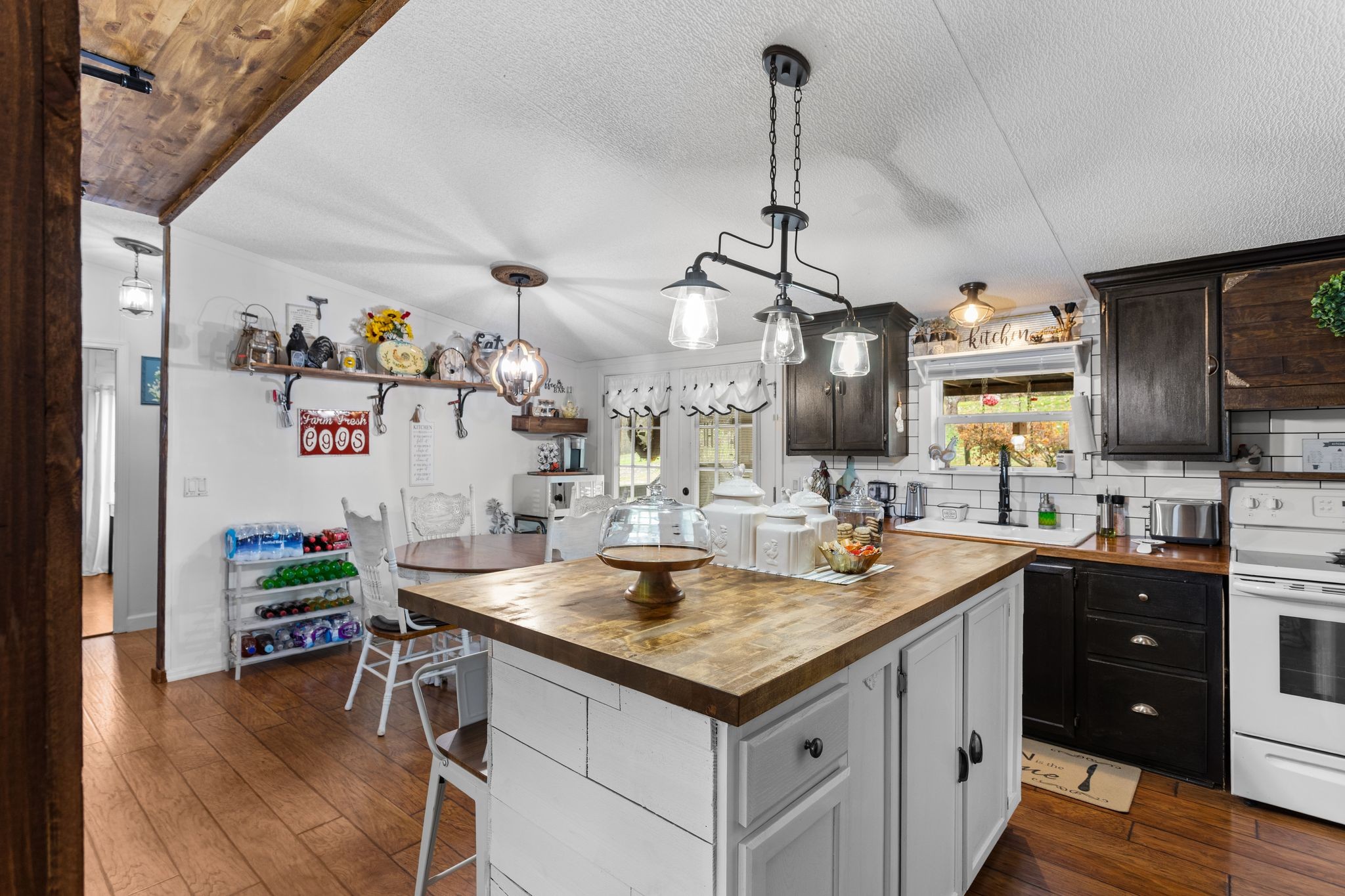1892 Preacher Holt Road Mount Pleasant, TN 38474 - Photo 13 of 36 a kitchen with a sink stove and wooden floor