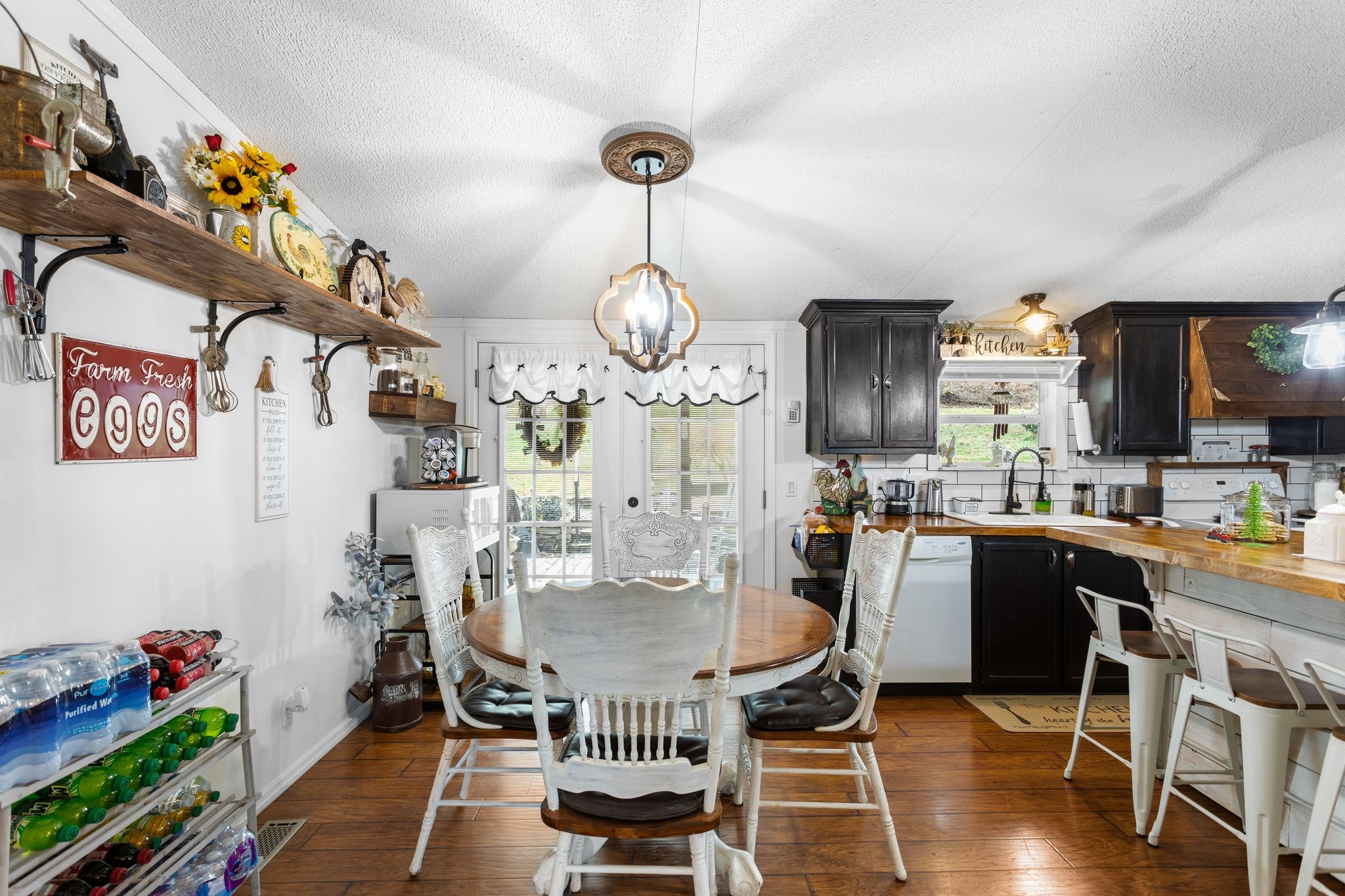 1892 Preacher Holt Road Mount Pleasant, TN 38474 - Photo 14 of 36 a dining room filled chandelier and wooden floor