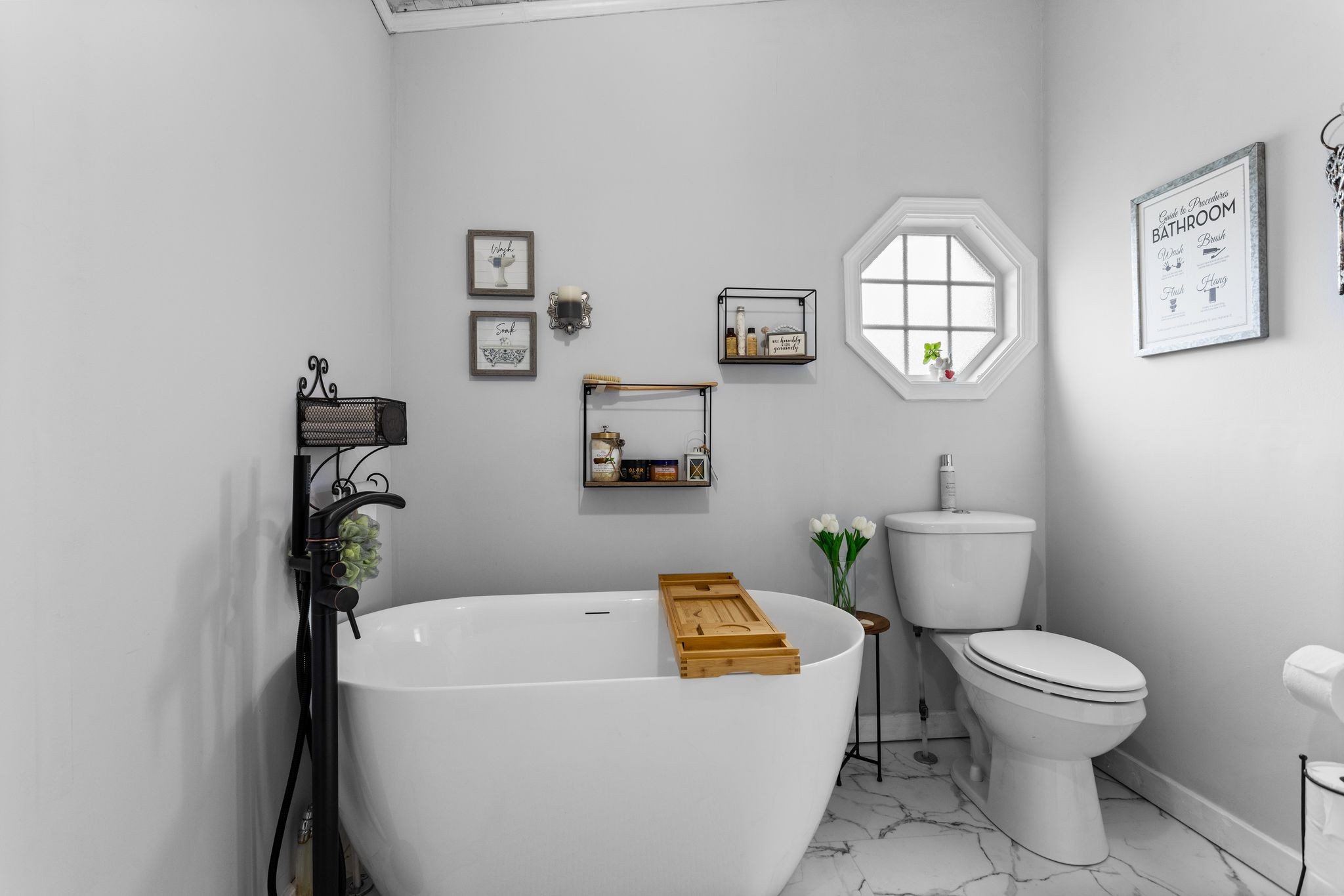 1892 Preacher Holt Road Mount Pleasant, TN 38474 - Photo 19 of 36 a white toilet sitting next to a bathroom sink and tub