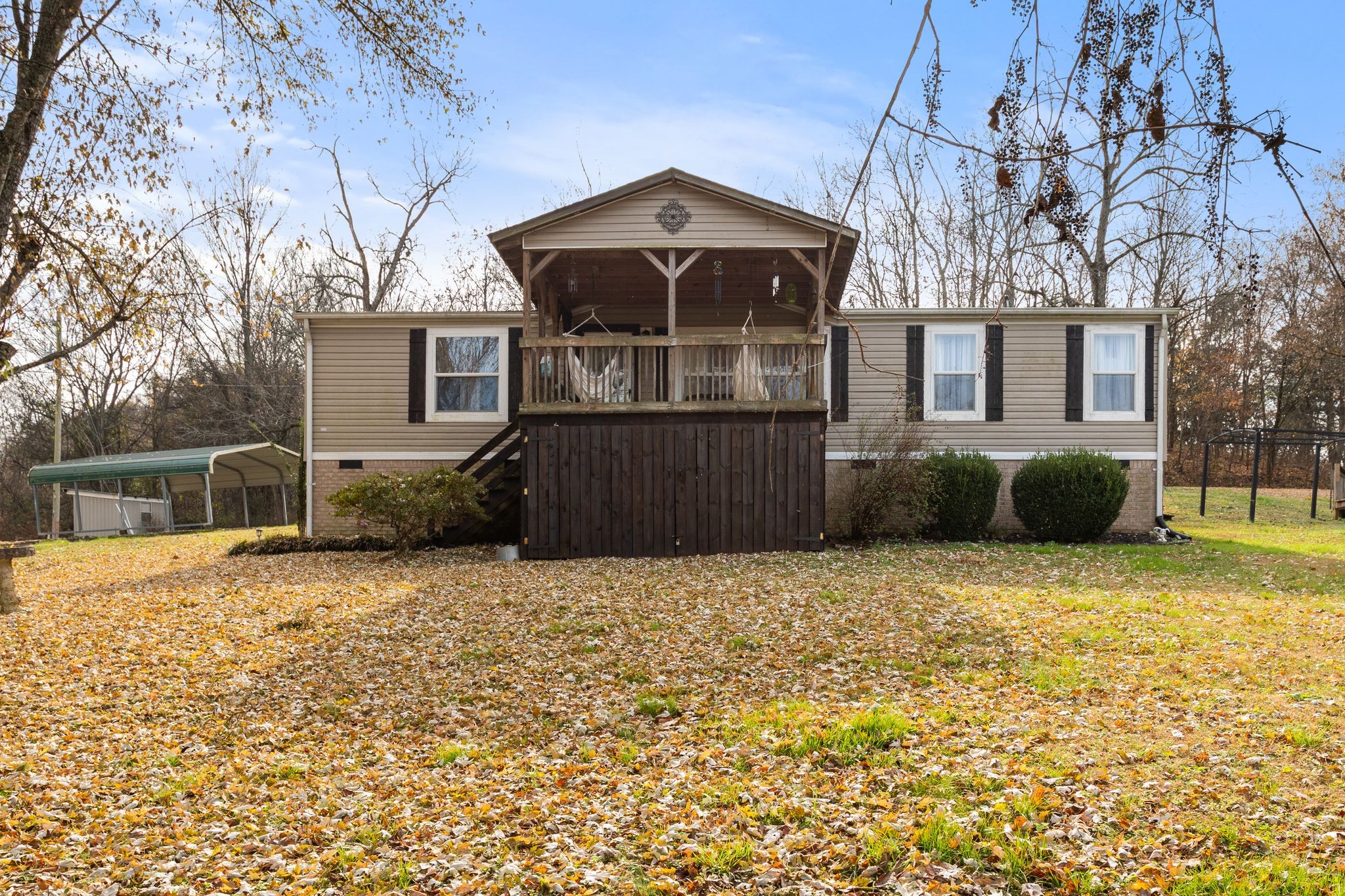 1892 Preacher Holt Road Mount Pleasant, TN 38474 - Photo 26 of 36 a front view of a house with a yard