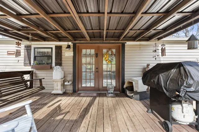 a view of a balcony with wooden floor