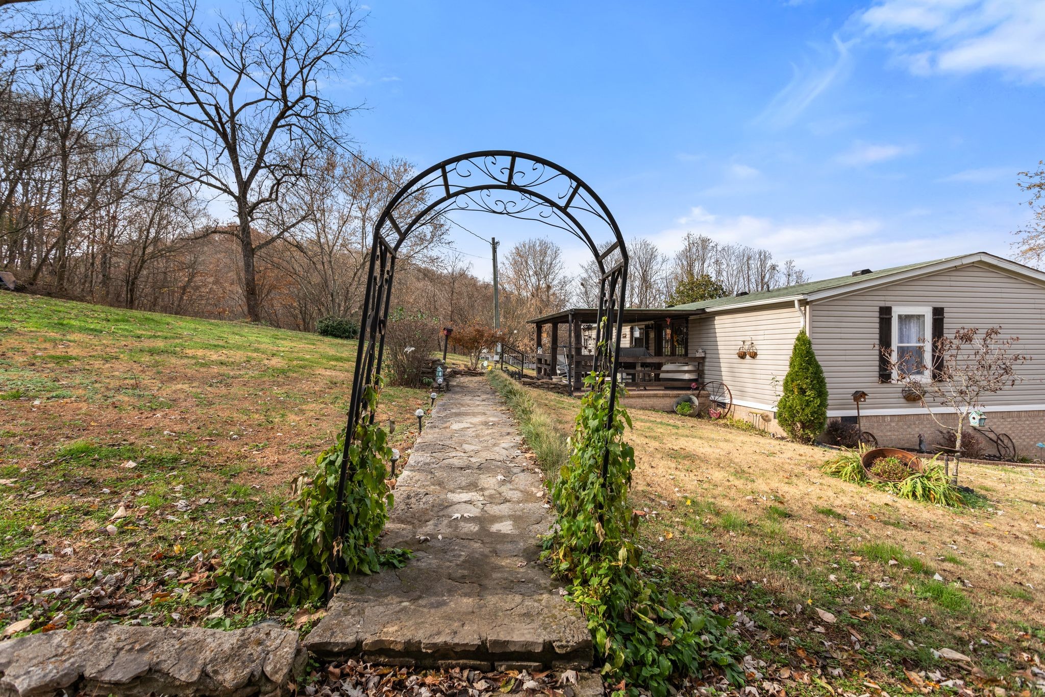 1892 Preacher Holt Road Mount Pleasant, TN 38474 - Photo 29 of 36 a backyard of a house with table and chairs