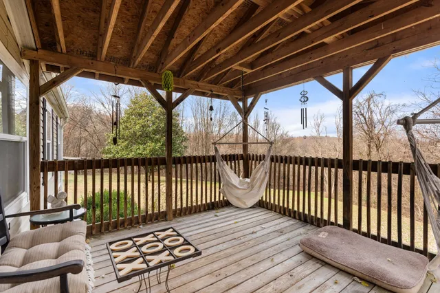a view of porch with wooden floor