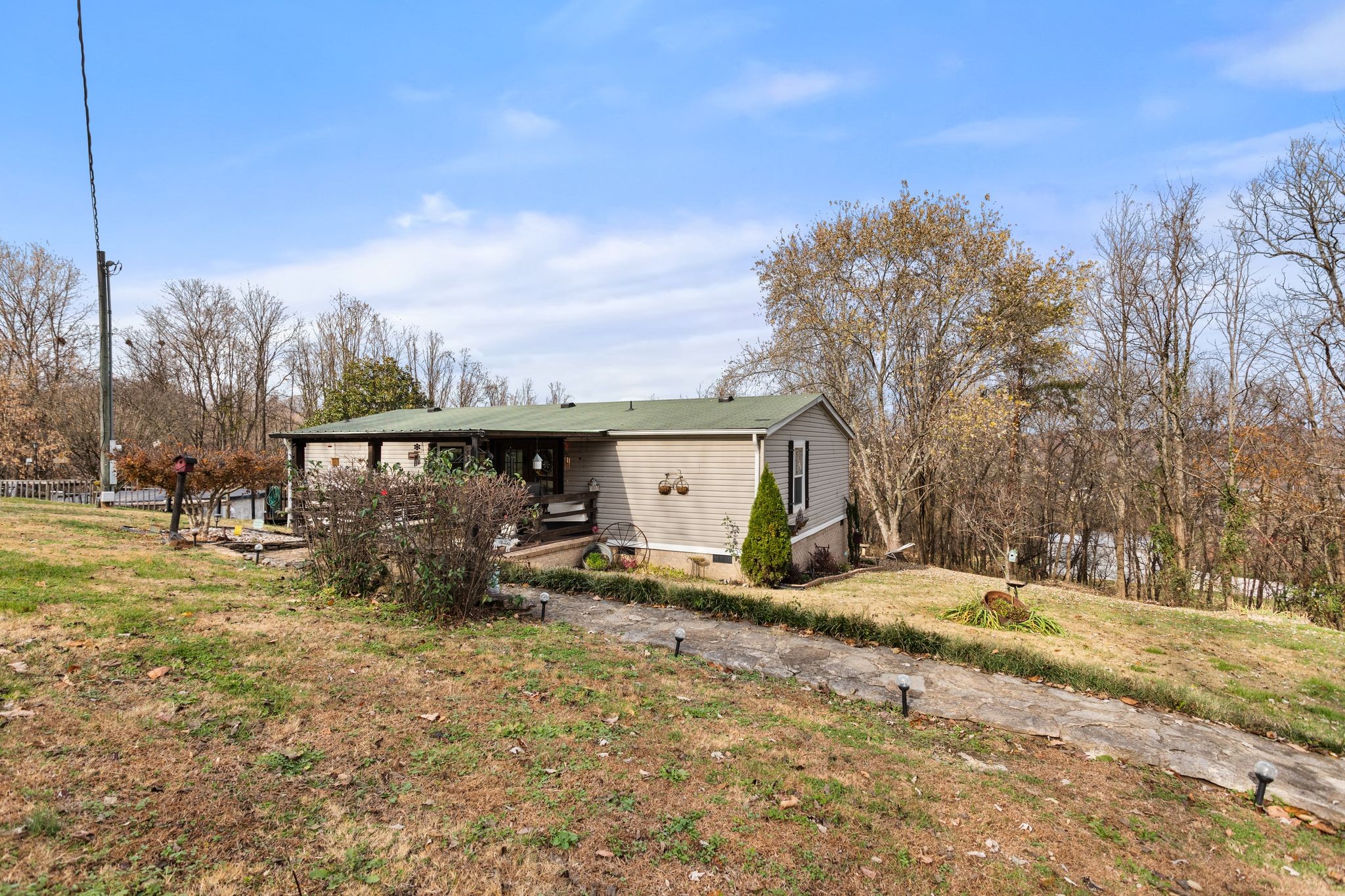1892 Preacher Holt Road Mount Pleasant, TN 38474 - Photo 32 of 36 a view of a house with a yard covered in snow