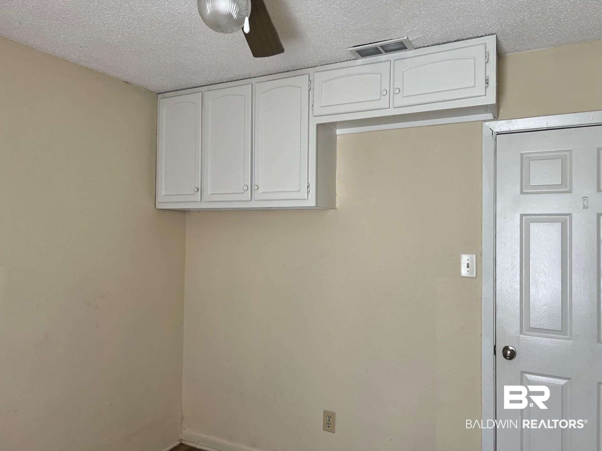 72 Grimes Lane Loxley, AL 36551 - Photo 11 of 12 Laundry room with a textured ceiling and ceiling fan