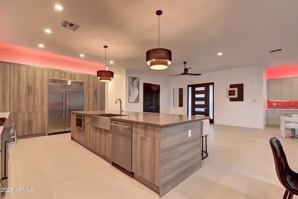 a dining room with furniture and wooden floor