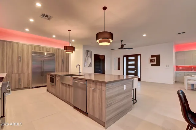 a dining room with furniture and wooden floor
