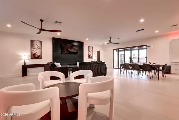 a view of a dining room with furniture and a window