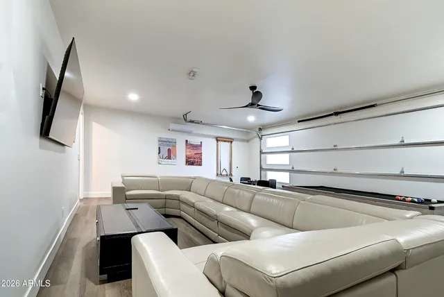 a bedroom with a large bed and a flat screen tv