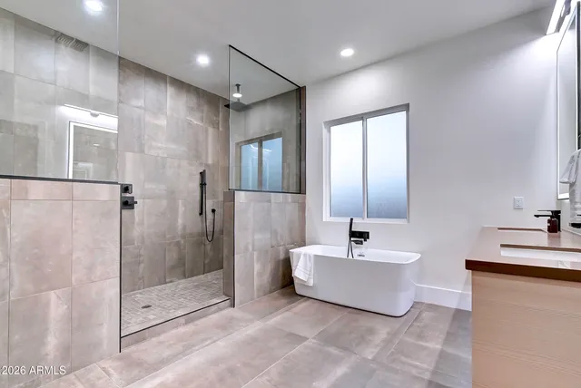 a bedroom with a bed and a couch