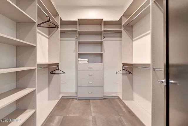 a view of a swimming pool and lounge chairs