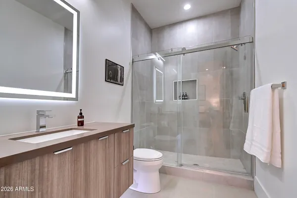 a bedroom with a bed and a television