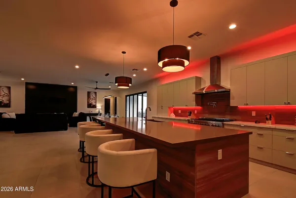 a kitchen with stainless steel appliances granite countertop a stove and a sink