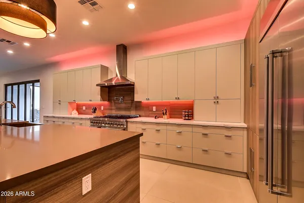 a large kitchen with kitchen island a large island in the center