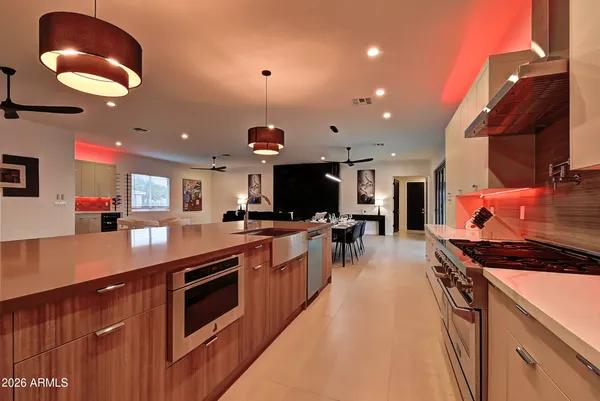 a kitchen with stainless steel appliances granite countertop a stove and a sink