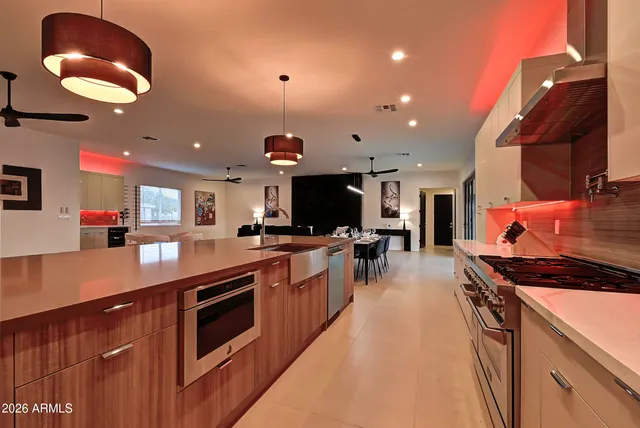 a kitchen with stainless steel appliances granite countertop a stove and a sink