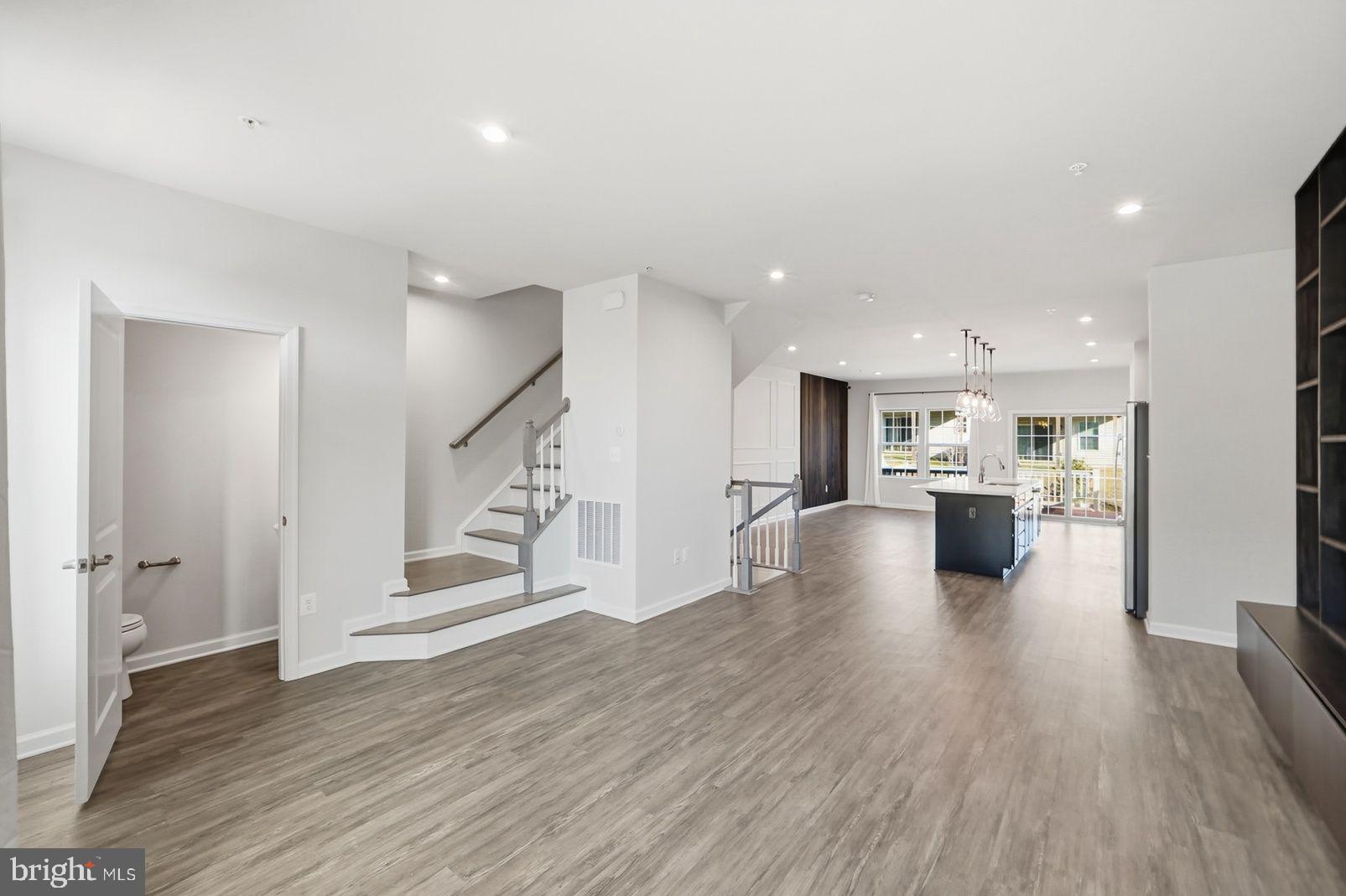 7917 Gladden Farm Way Hanover, MD 21076 - Photo 14 of 28 a view of a living room and wooden floor