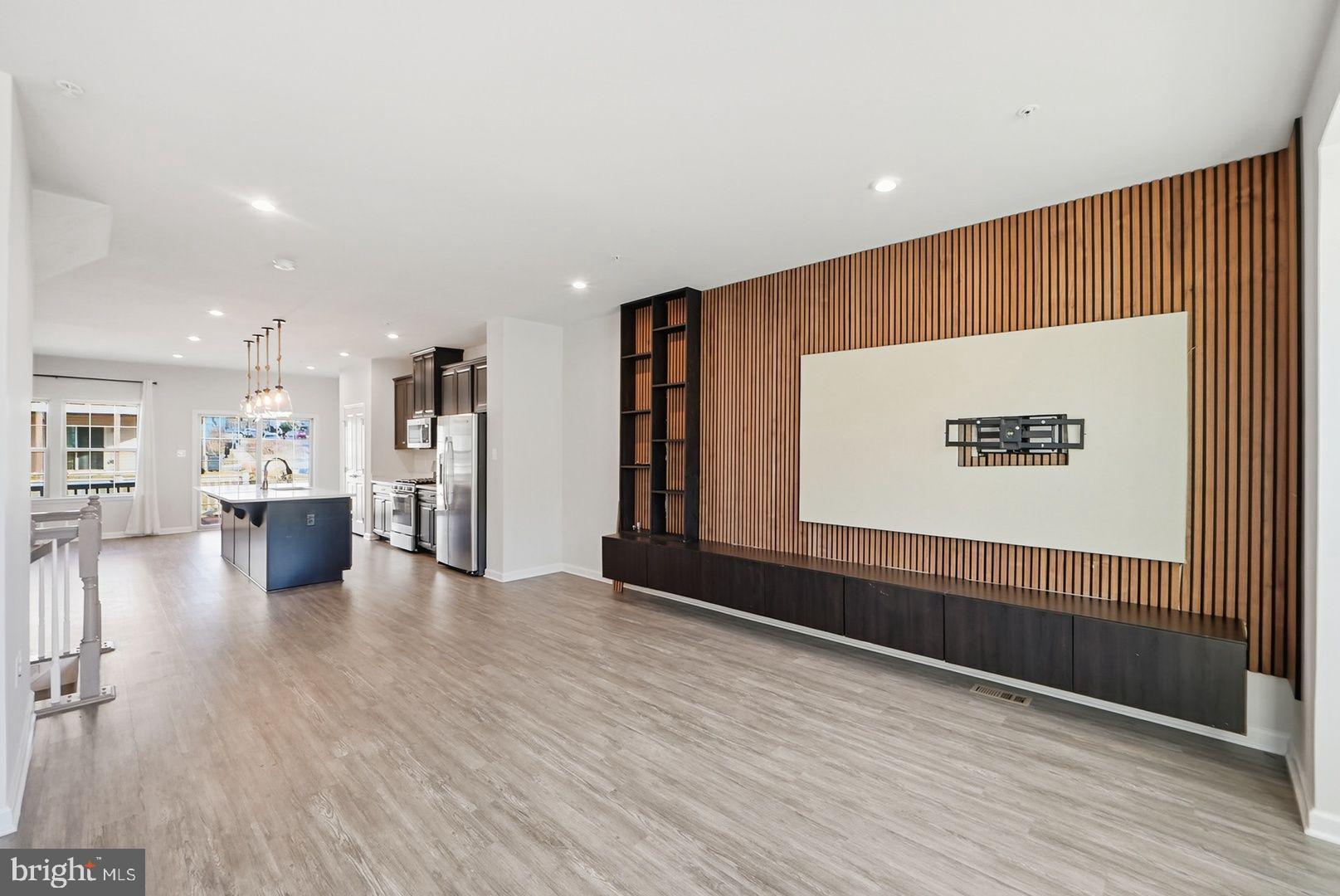 7917 Gladden Farm Way Hanover, MD 21076 - Photo 16 of 28 a view of a kitchen with a refrigerator and wooden floor