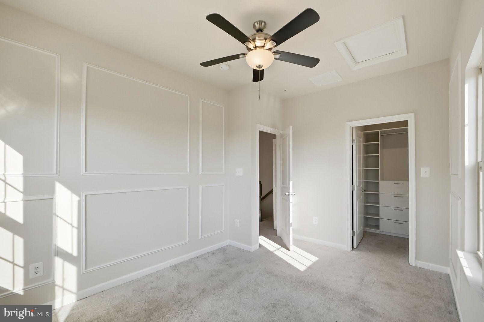 7917 Gladden Farm Way Hanover, MD 21076 - Photo 24 of 28 an empty room with closet and a ceiling fan