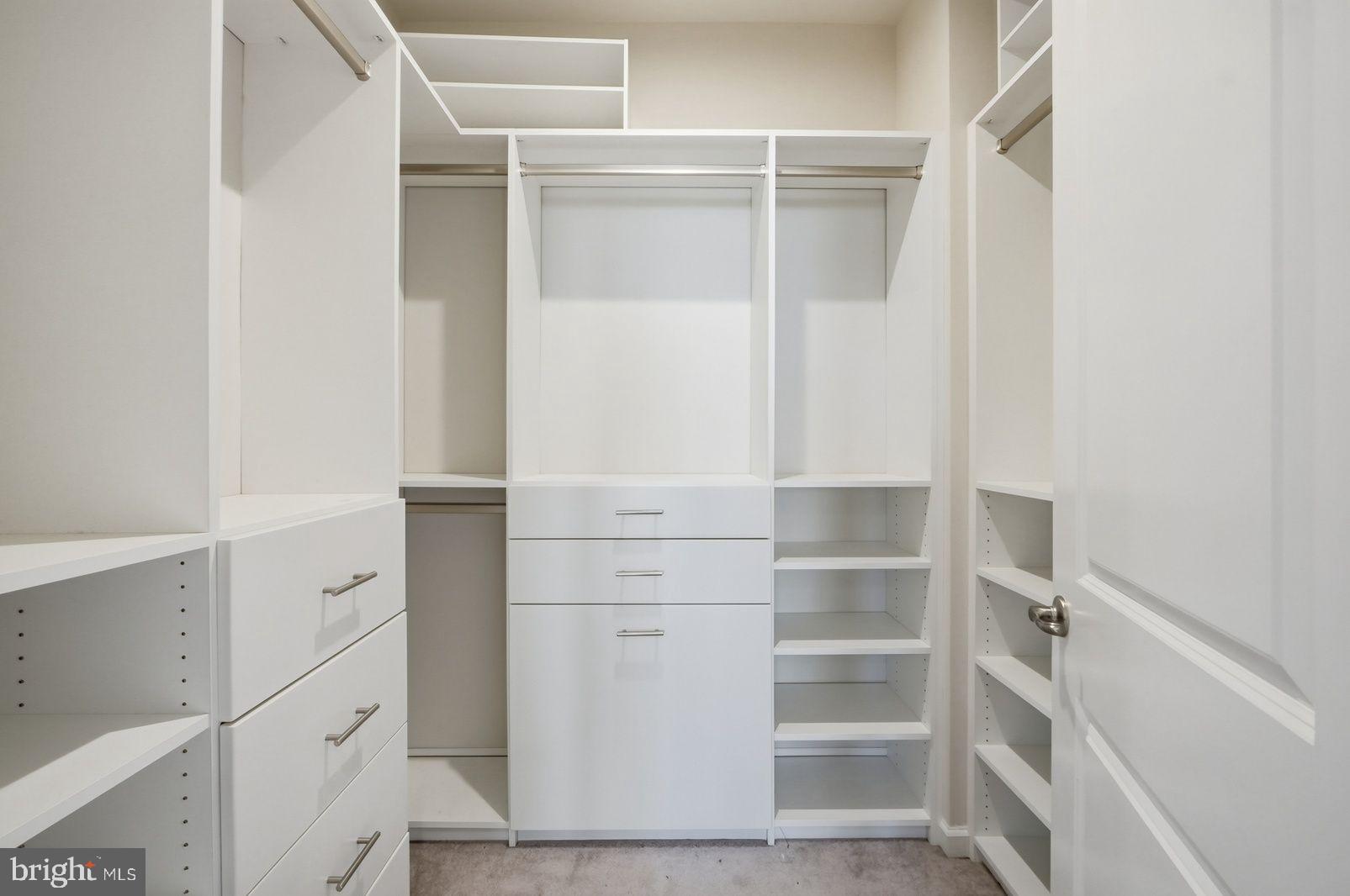 7917 Gladden Farm Way Hanover, MD 21076 - Photo 25 of 28 a view of walk in closet with empty racks