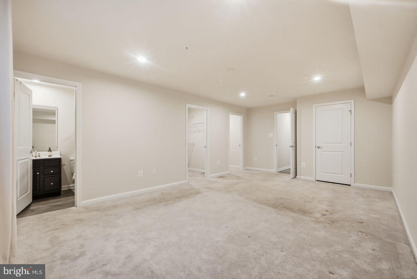 7917 Gladden Farm Way Hanover, MD 21076 - Photo 6 of 28 an empty room with closet and bathroom