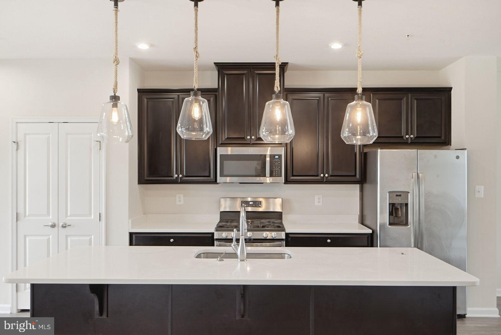 7917 Gladden Farm Way Hanover, MD 21076 - Photo 10 of 28 a kitchen with cabinets and stainless steel appliances