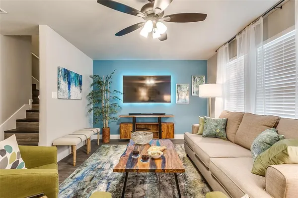 a living room with furniture and a flat screen tv