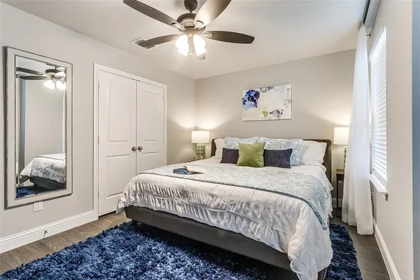a bedroom with bed and window