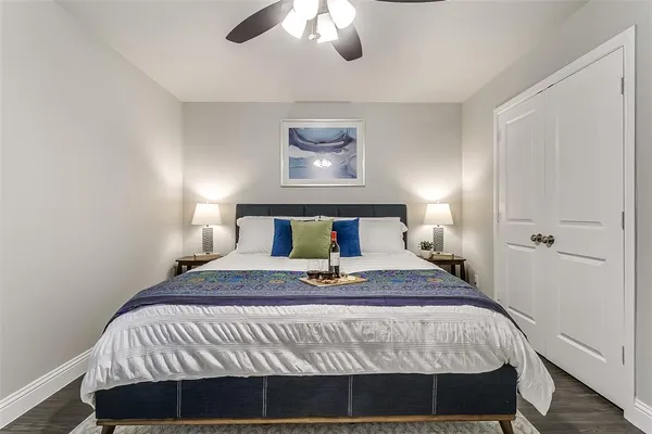 a bedroom with a bed and a lamp