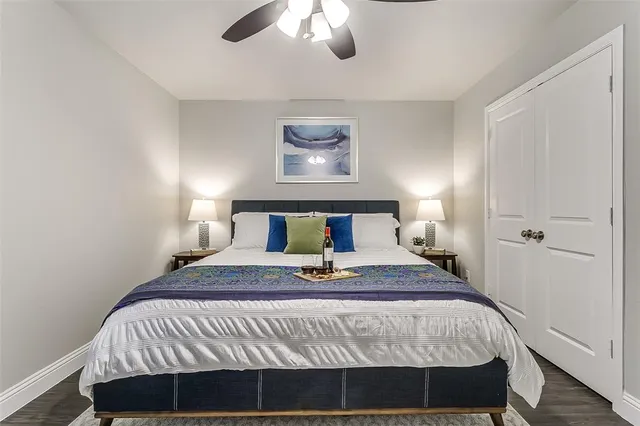 a bedroom with a bed and a lamp