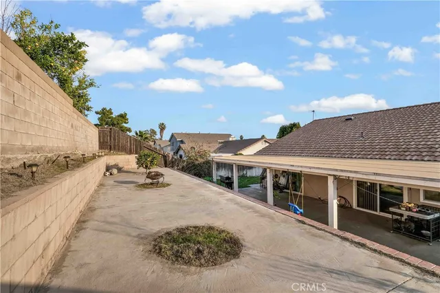 a view of a house with backyard porch and sitting area