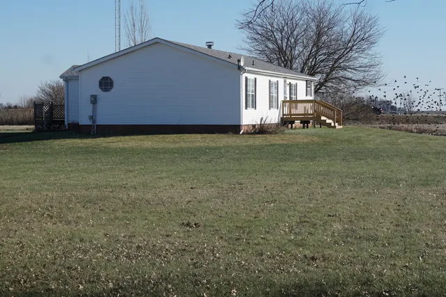 a kitchen with a sink cabinets and window