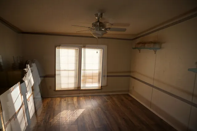 a bathroom with a granite countertop sink a mirror and bathtub