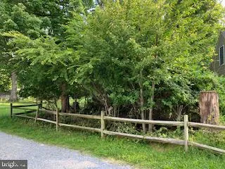 a view of outdoor space with deck and yard
