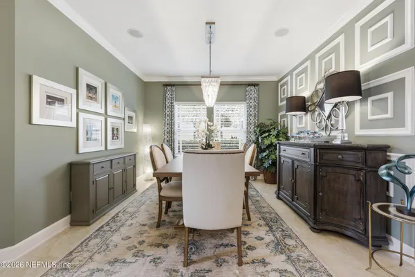a kitchen with stainless steel appliances kitchen island granite countertop a stove a sink a refrigerator and a refrigerator