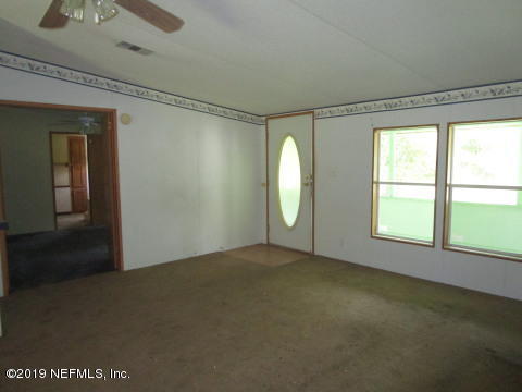 1585 Blair Road Jacksonville, FL 32221 - Photo 3 of 14 an empty room with windows