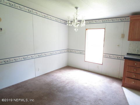 1585 Blair Road Jacksonville, FL 32221 - Photo 4 of 14 a view of an empty room with a window