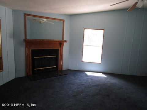 1585 Blair Road Jacksonville, FL 32221 - Photo 7 of 14 a view of empty room with a fireplace