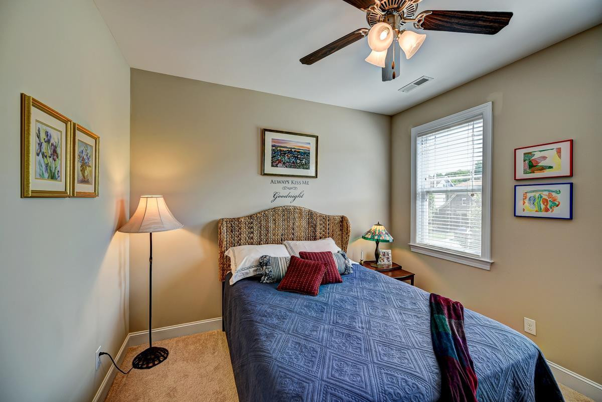 1212 Barnford Mill Road Wake Forest, NC 27587 - Photo 20 of 30 Bedroom two has ceiling fan, single window and carpet 11.4 x 10.11 Bedroom Two