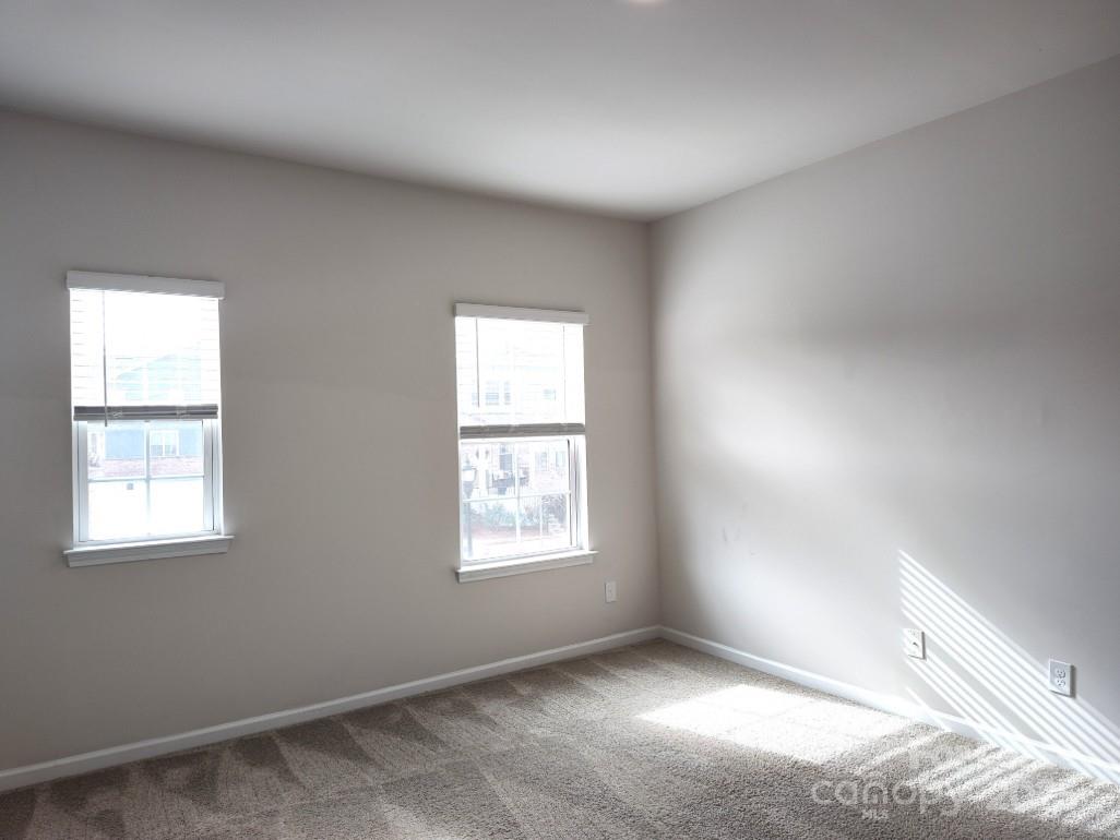 3327 Glenn Hope Way Matthews, NC 28104 - Photo 15 of 23 an empty room with windows
