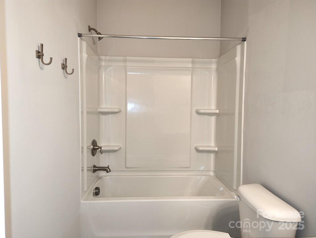 3327 Glenn Hope Way Matthews, NC 28104 - Photo 18 of 23 a bathroom with a shower and a bath tub