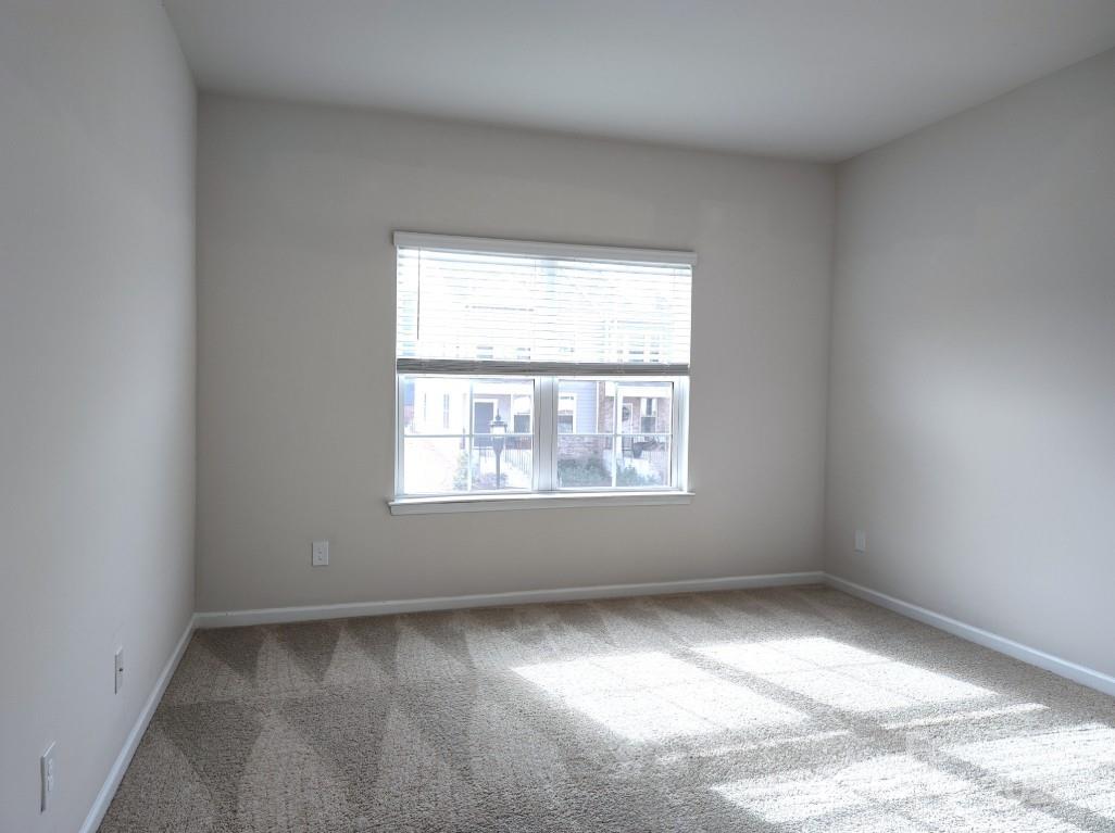 3327 Glenn Hope Way Matthews, NC 28104 - Photo 19 of 23 an empty room with a window