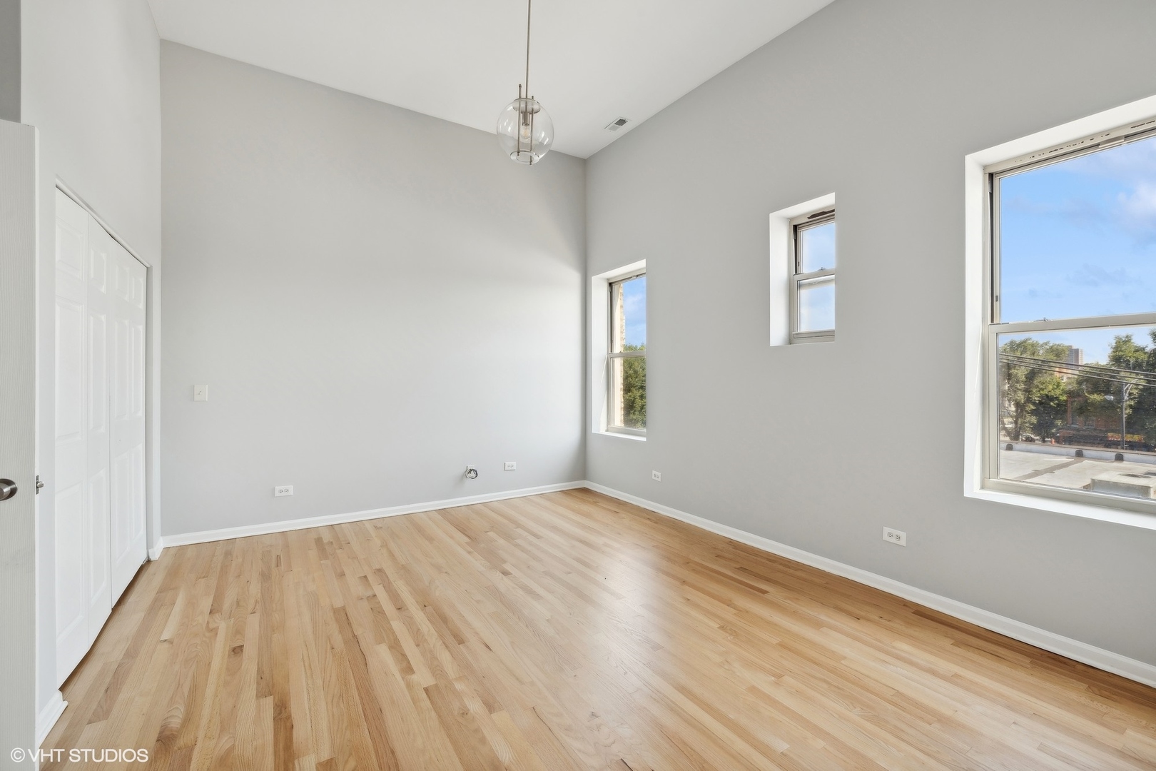 4646 South Prairie Avenue, Unit 3S Chicago, IL 60653 - Photo 14 of 42 wooden floor in an empty room with a window