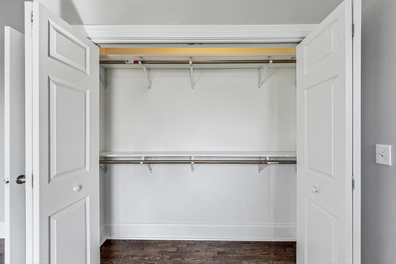 4646 South Prairie Avenue, Unit 3S Chicago, IL 60653 - Photo 17 of 42 a view of walk in closet with empty racks