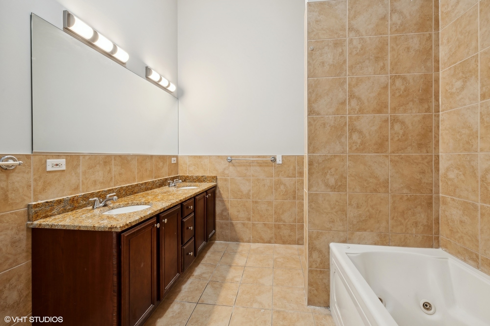 4646 South Prairie Avenue, Unit 3S Chicago, IL 60653 - Photo 18 of 42 a bathroom with a granite countertop bathtub a sink and a shower