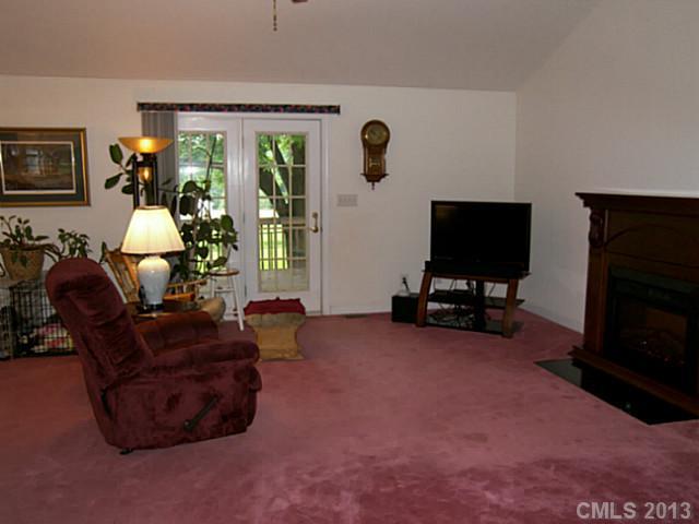 5711 Griffith Road Monroe, NC 28112 - Photo 11 of 16 a living room with furniture and a flat screen tv
