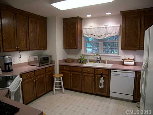 5711 Griffith Road Monroe, NC 28112 - Photo 10 of 16 a kitchen with a sink cabinets and window
